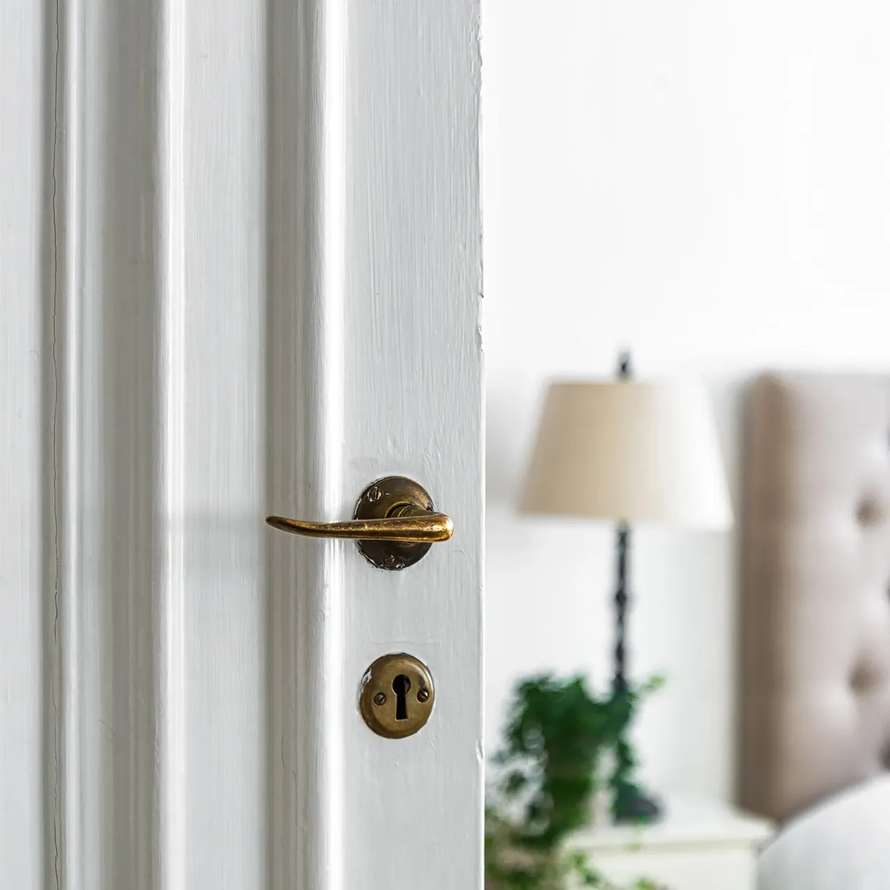 Old lock knob white wooden door room lights